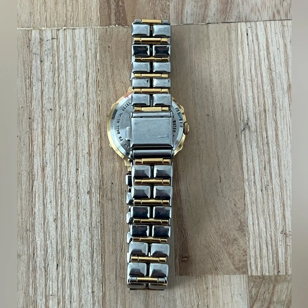 Bulova Ladies Watch Two-Tone Bracelet Case Sparkling Silver Dial Gold-Tone Hands